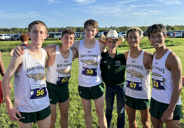 The Boys Cross Country Team flicking  up after a great win.